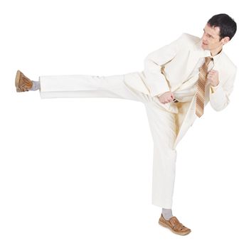The man in a light suit beats a foot, is isolated on a white background