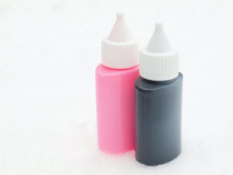 Black and pink tubes on a snow    