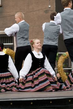 Traditional Latvian folk dancing, performed at the Riga city hall, Latvia, September 27, 2008