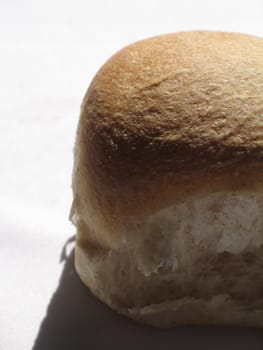 small bread bun casting shadow