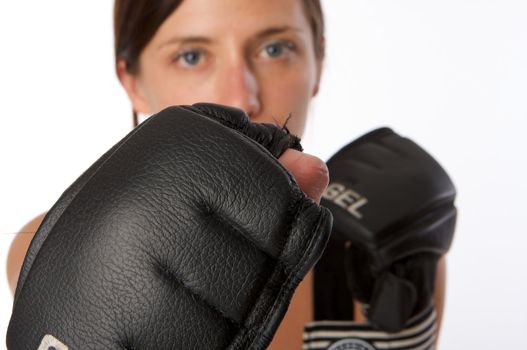 An image of a woman in gym clothes, with boxing gloves, strength and fitness