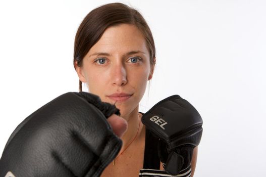 An image of a woman in gym clothes, with boxing gloves, strength and fitness