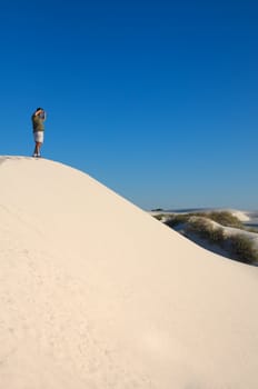 An image of a man exploring in the desert
