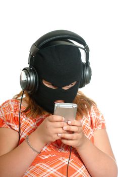 Concept image of a young girl listening to pirated or illegal music downloads on her mp3 player, isolated against a white background.