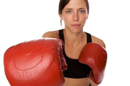 An image of a woman in gym clothes, with boxing gloves, strength and fitness