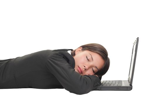 Tired overworked business woman sleeping on her laptop being exhausted from work, Beautiful mixed race Chinese Asian-Caucasian young businesswoman isolated on white and lying down on the floor. 