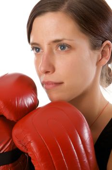 An image of a woman in gym clothes, with boxing gloves, strength and fitness