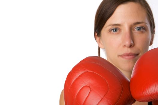 An image of a woman in gym clothes, with boxing gloves, strength and fitness