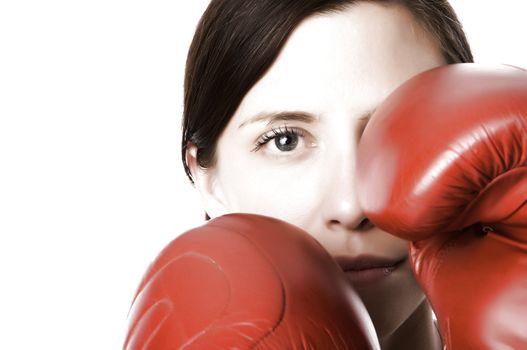 An image of a woman in gym clothes, with boxing gloves, strength and fitness