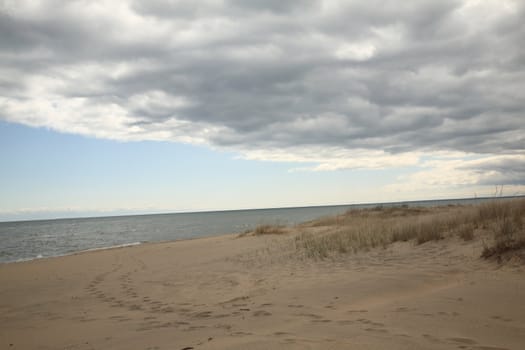 Approaching storm rolls in to sandy shoreline of Great Lake