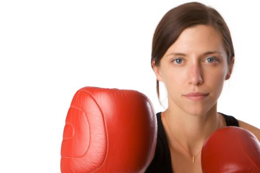 An image of a woman in gym clothes, with boxing gloves, strength and fitness