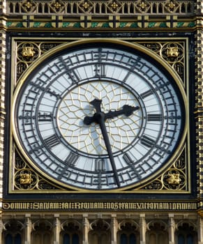 A close up of the clock face on the tower that contains Big Ben in London.