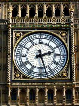 A close up of the clock face on the tower that contains Big Ben in London.