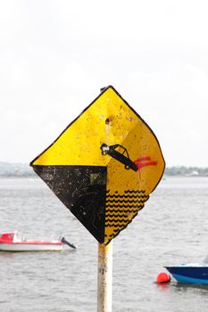 a warning sign on an irish quay