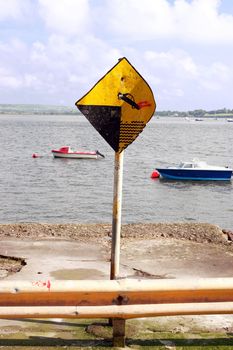 a warning sign on an irish quay