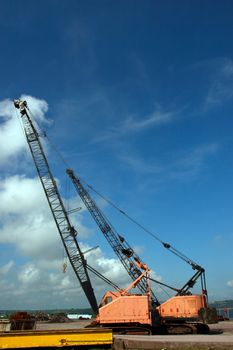 a pair of cranes on an irish quay