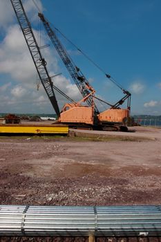 a pair of cranes on an irish quay