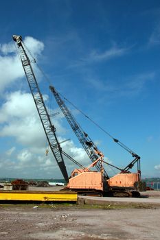 a pair of cranes on an irish quay