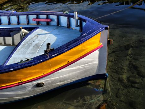 image of a boat in a mediterranean harbor