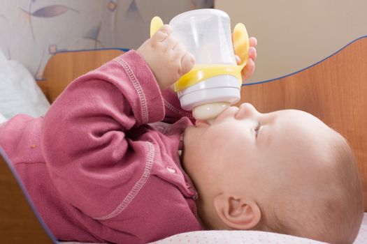 Baby drink milk from bottle