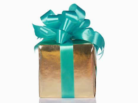 Gold present with green bow and ribbons