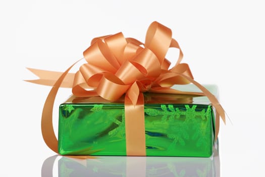 Green present with orange bow and ribbons