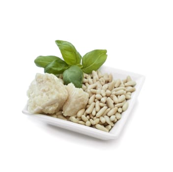 Small basket with bread, basil, pine nuts and parmesan