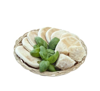 Small basket with bread, basil and parmesan