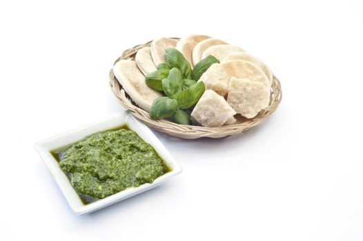 
basil sauce typical of Ligurian cuisine on white background