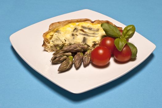 
Asparagus omelet served with tomatoes and basil