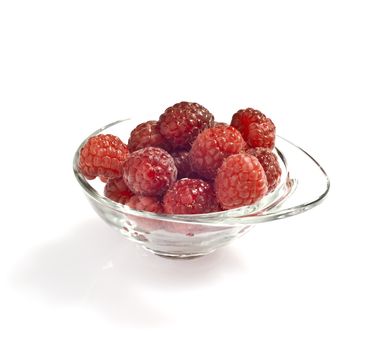 freshly picked raspberries on white background