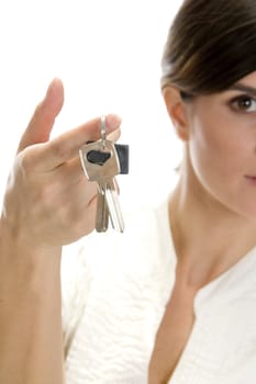 lady with keys in her finger with white background