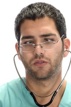 doctor with stethoscope in his ears looking squint against white background