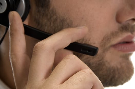 close up of young businessman adjusting his headset