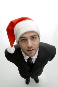 businessman with santa cap against white background