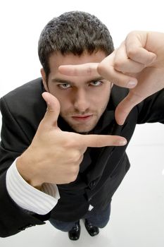 businessman making frame with fingers with white background