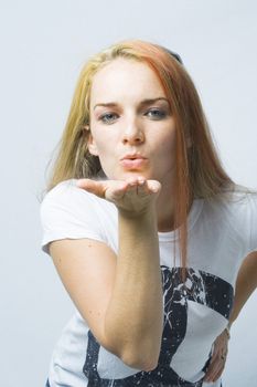 Model blows a kiss for the camera.