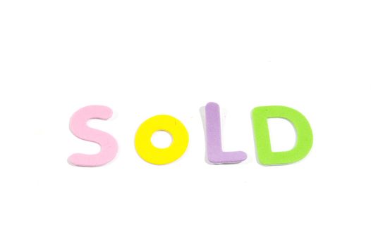 sold in colorfull letters isolated on white