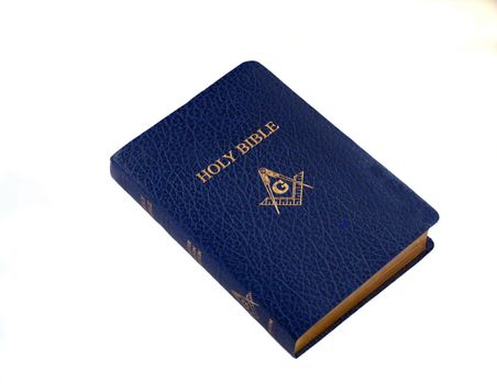 a blue leather Masonic Bible, with gold lettering, on a white background