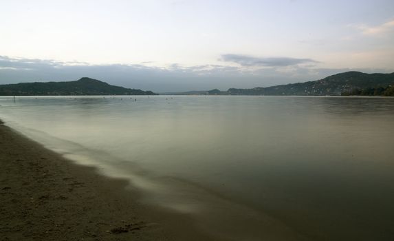 a fall's sunrise in a lake beach