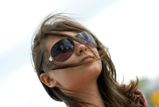 portrait of a beautiful teenage girl in sunglasses