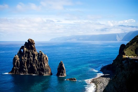 View of the Western Madeira coast with yellow taxi