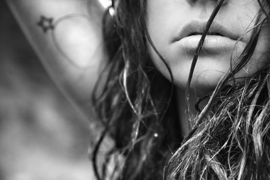 Young adult Caucasian female face and disheveled hair.