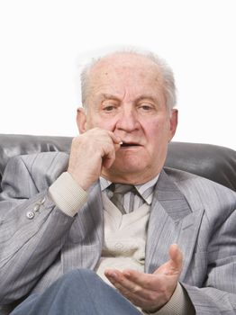 Portrait of a senior man taking his medication.