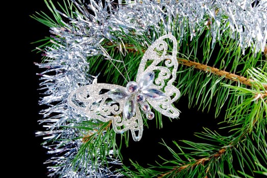 Christmas tree ornaments  on dark background .butterfly