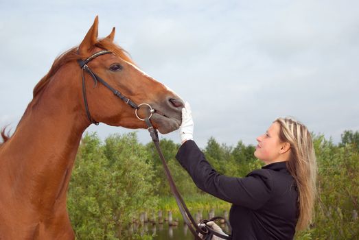 girl with horse.Friendship of an animal and the person