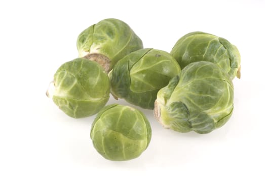 Couple of brussels sprouts isolated on a white background.