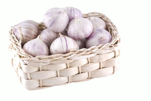 Basket with beautiful garlic isolated on white.