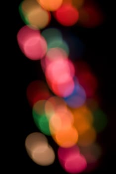 a colorful background of out of focus light (bokeh) circles