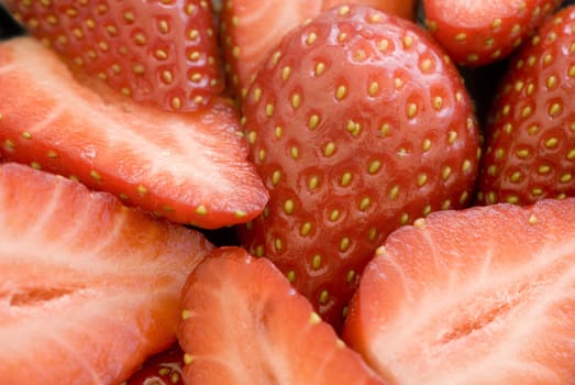 close up on some sliced ripe strawberries